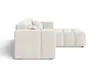 A side view of a modern, cream-colored sectional sofa with a channel-tufted design. Produktbild-Vorschau