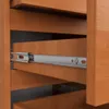 Close-up view of a wooden drawer with a metal slide mechanism. Produktbild-Vorschau