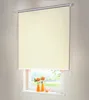 A cream-colored roller blind is shown covering most of a window, with a glimpse of an outdoor scene and two small orange vases with flowers on the windowsill below. Produktbild-Vorschau
