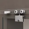 Close-up of a sliding glass door hardware system mounted on a wall. Produktbild-Vorschau