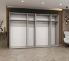 An empty wardrobe with multiple compartments and hanging rails, set in a modern room with wooden flooring and a decorative wall panel. Produktbild-Vorschau