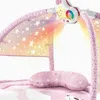 A close-up view of a baby play gym with a projection of stars and colorful lights. Náhled obrázku produktu