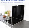 A kitchen scene with a stovetop, a pot, and splash guards. Produktbild-Vorschau