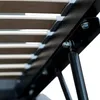 A close-up view of the slatted base and support mechanism of a bed frame. Voir les images du produit