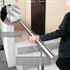 An elderly person is using a silver stainless steel handrail on a staircase. Produktbild-Vorschau