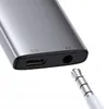 Close-up of a USB-C adapter with a headphone jack and a USB-C port, with a headphone jack plug in the foreground. Náhľad obrázku produktu