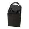 A black battery with a black handle on top, shown from a side angle against a white background. Voir les images du produit