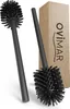 Two black toilet brushes and a cardboard box with branding. Produktbild-Vorschau