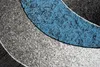 A close-up abstract view of a rug with curved bands of color. Náhľad obrázku produktu