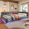 A modern bedroom with a grey upholstered daybed featuring LED lighting and a laptop on it. The room has decorative wall panels, artwork, and a large window. Produktbild-Vorschau