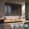A modern living room with a TV mounted on the wall above a wooden media console. Produktbild-Vorschau