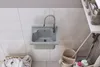 A sink in a laundry room or workshop setting. Anteprima dell’immagine prodotto