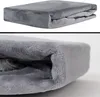 A folded gray plush blanket is shown in two close-up views. Produktbild-Vorschau