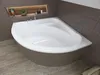 A white corner bathtub with a tiled base and a niche in the wall above it. Produktbild-Vorschau