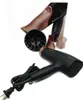 A black Panasonic hair dryer with copper accents and its accessories, including a diffuser and concentrator nozzle, are displayed on a white background. The product packaging is partially visible in the background. Podgląd zdjęcia produktu