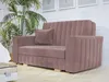 A mauve sofa with a single throw pillow is shown in a well-lit room with a large potted plant and framed art on the wall. Náhled obrázku produktu
