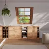 A room with wooden cabinets and a window overlooking trees. Produktbild-Vorschau