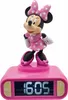 A pink digital alarm clock with a Minnie Mouse figurine on top. Voir les images du produit