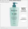 A bottle of Kerastase shampoo with marketing text and icons. Náhled obrázku produktu