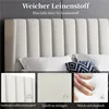 A close-up view of a beige upholstered headboard with pillows, and three smaller inset images showcasing product features. Produktbild-Vorschau