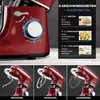 A red kitchen mixer with various attachments and a diagram showing speed settings and corresponding food types. Produktbild-Vorschau