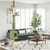 A living room scene with a green couch, a coffee table, a large plant, and a cat tree with two cats. Anteprima dell’immagine prodotto