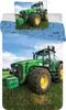 A close-up of a green tractor on a grassy field with a blue sky in the background. The image also shows a pillowcase and a duvet cover with tractor graphics. Produktbild-Vorschau