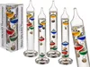 A product shot of multiple Galileo thermometers and their packaging. Produktbild-Vorschau