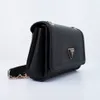 A black Guess handbag is shown against a white background. Produktbild-Vorschau