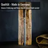 A sharpening steel is mounted on a piece of rustic wood, with text overlay. Voir les images du produit