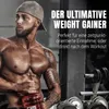 A muscular man in a gym holding a red shaker bottle, with gym equipment in the background. Produktbild-Vorschau