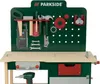 A toy workbench with various tools and accessories displayed on a pegboard and the workbench surface. Produktbild-Vorschau