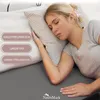 A woman sleeping on a pillow with text overlays. Produktbild-Vorschau
