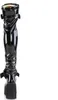 A single black patent leather boot with a platform sole, shown from the back. Produktbild-Vorschau