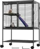 A multi-level pet cage with a ramp, on wheels, with two small animals inside. Anteprima dell’immagine prodotto
