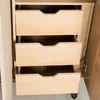 The image shows the interior of a wardrobe with three open drawers. Produktbild-Vorschau