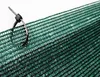A close-up of green netting secured with a black zip tie. Anteprima dell’immagine prodotto