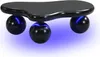 A black, cloud-shaped coffee table with three spherical legs emitting blue light, shown against a white background. Voir les images du produit