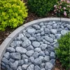 Silver-Kieselsteine als Beeteinfassung mit Bordstein im Garten Produktbild-Vorschau