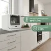 A white countertop dishwasher is shown in a modern kitchen setting with white cabinets and a gray countertop. Produktbild-Vorschau