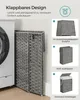 A laundry basket is shown next to a washing machine, with inset images demonstrating its folding mechanism and setup. Produktbild-Vorschau