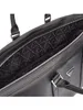 Close-up view of the interior lining of a black Guess weekender bag, showing the repeating 'GUESS' logo pattern. Produktbild-Vorschau