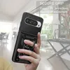 A hand holding a black phone case with a ring holder, with a blurred indoor background. Produktbild-Vorschau