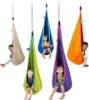Five children are sitting in colorful hanging cocoon chairs. Náhled obrázku produktu