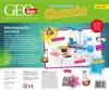 A flat lay of a chemistry experiment box with various components and labels. Voir les images du produit