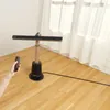 A person is holding a remote control next to a Shark brand fan in a room with white curtains and wooden floors. Podgląd zdjęcia produktu