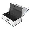 A book-shaped safe with its lid open, revealing the interior compartment. The safe has a 3-digit combination lock on the front. Produktbild-Vorschau