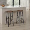 Two bar stools are placed in front of a kitchen island with a bowl of fruit on it. Náhled obrázku produktu