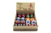 A display box filled with small, colorful wooden robots. Voir les images du produit