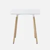 A square white table with four wooden legs against a white background. Anteprima dell’immagine prodotto